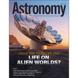 Astronomy magazine cover with a telescope and mountainous landscape