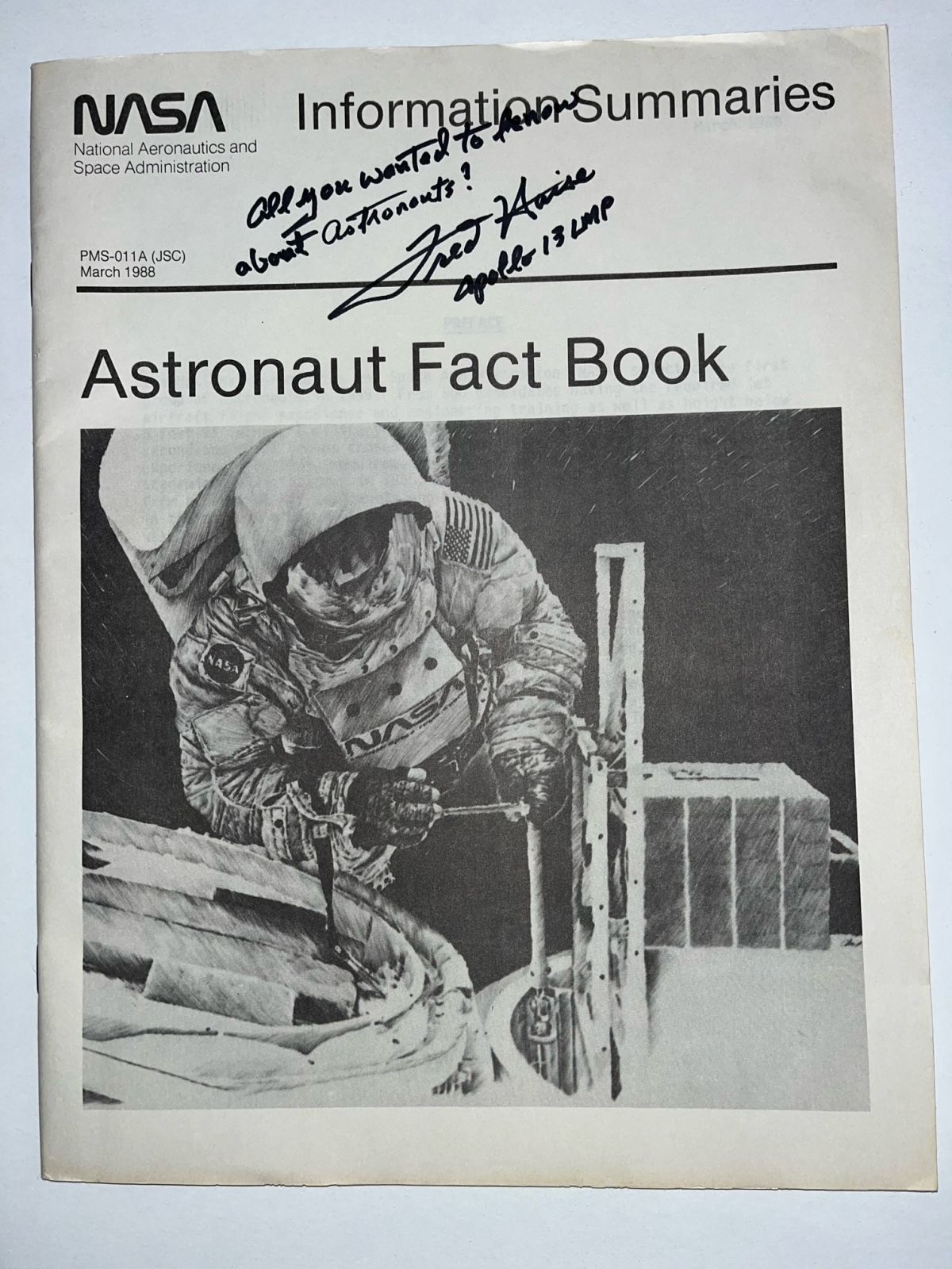 NASA Astronaut Informative Summaries Astronaut Fact Book signed by Fred Haise - The Space Store